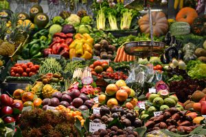fruits and vegetables in an indoor fresh food market